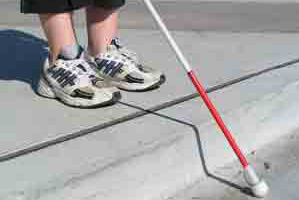 Stock image of blind person walking